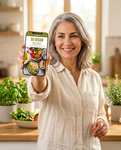 Woman holding phone displaying 50 Vegan Recipes ebook