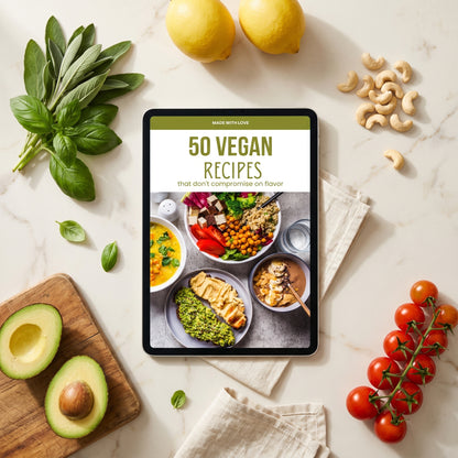 Vegan ebook on tablet in kitchen with fresh herbs and avocado